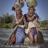 (fKakureukua (left) and Vahepapi (right) at Kunene river. Both women cross the river in an effort to escape hunger in Angola.