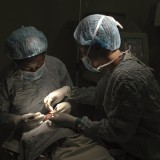Surgeons work to try and save a child's life.