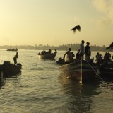 Fishing boats line the shoreline at Kivukoni Fish Market in Dar Es Salaam, Tanzaina.