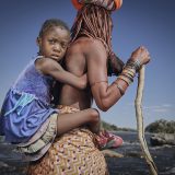 Kaevarua and her grand daughter at Kuene river which many Angolan migrants have crossed after experiencing an intense drought in their homeland