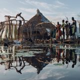 Families live on isolated man made floating grass islands to survive three years of continuous flooding.