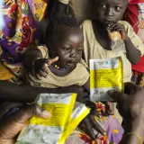 Ibrahim Hassan's child was diagnosed with acute malnutrition and administered a high-energy food sachet by Relief International at the Doro Camp reception center in Maban.