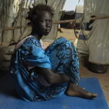 Portrait of Nyasebit 13, who lost her parents in the Sudan war.