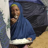 Deynabo Baoheat eats rice for her only meal of the day at Dugul Camp in Mogadishu.